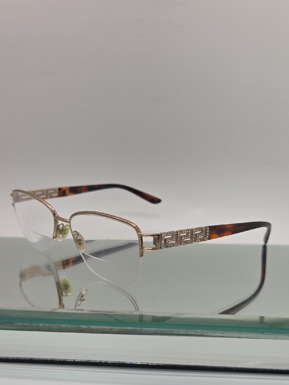 Versace Gold Rimless Glasses with Tortoiseshell Temples